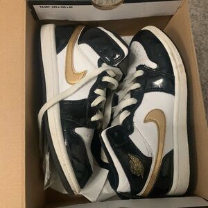 Size 2 boys black/white and gold Air Jordan’s with box